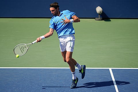 US Open 2024: Arthur Rinderknech, of France, returns a shot to Andrey Rublev, of Russia